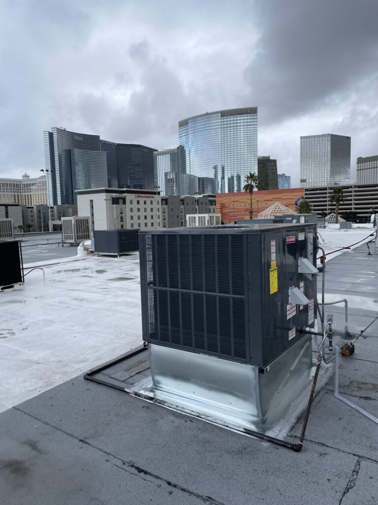 A commercial rooftop HVAC unit with a city skyline in the background, serviced by Allstar Heating & Cooling in Port Richey, FL
