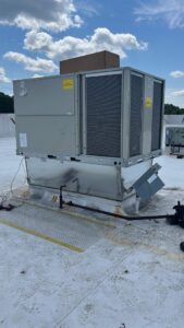 A large commercial rooftop HVAC unit being serviced or installed by Climate Mechanical in Dinwiddie, VA.