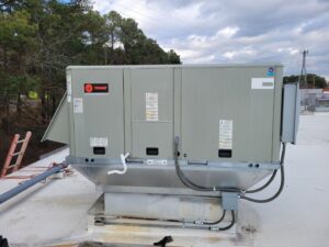 A large commercial rooftop HVAC unit installed by Comfort Hounds Heating & Cooling in Raleigh, NC.