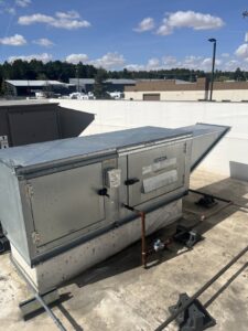 A large commercial rooftop HVAC unit on a sunny day, installed or maintained by Hvaclife in Minneapolis, MN.