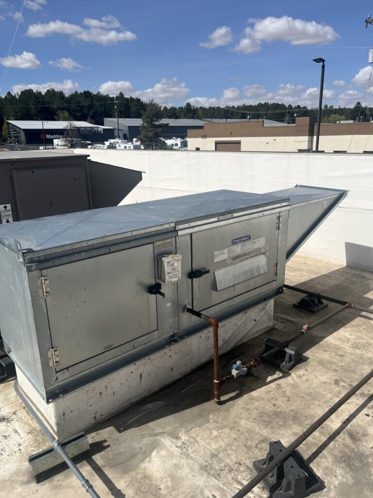 A large commercial rooftop HVAC unit on a sunny day, installed or maintained by Hvaclife in Minneapolis, MN.