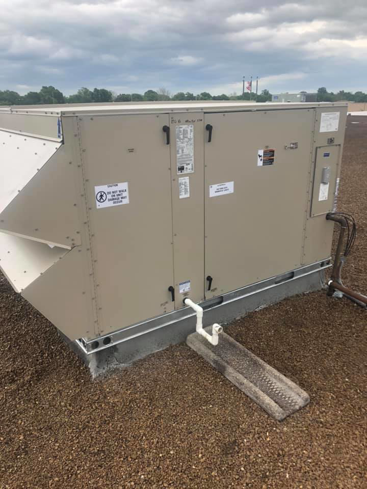 A large commercial rooftop HVAC unit installation by Arrowhead Mechanical HVAC in Woodville, OH