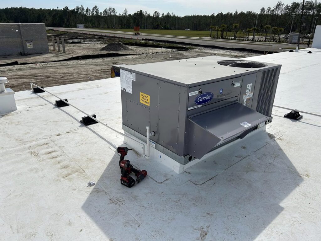 Commercial rooftop HVAC unit installation in progress by Huggins Mechanical in Jacksonville, FL