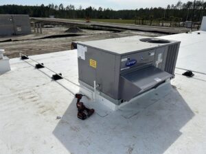Commercial rooftop HVAC unit installation in progress by Huggins Mechanical in Jacksonville, FL