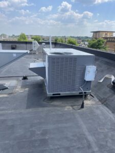 A large commercial rooftop HVAC unit installed on a building, demonstrating services by Jons-Air in Carmel, IN.