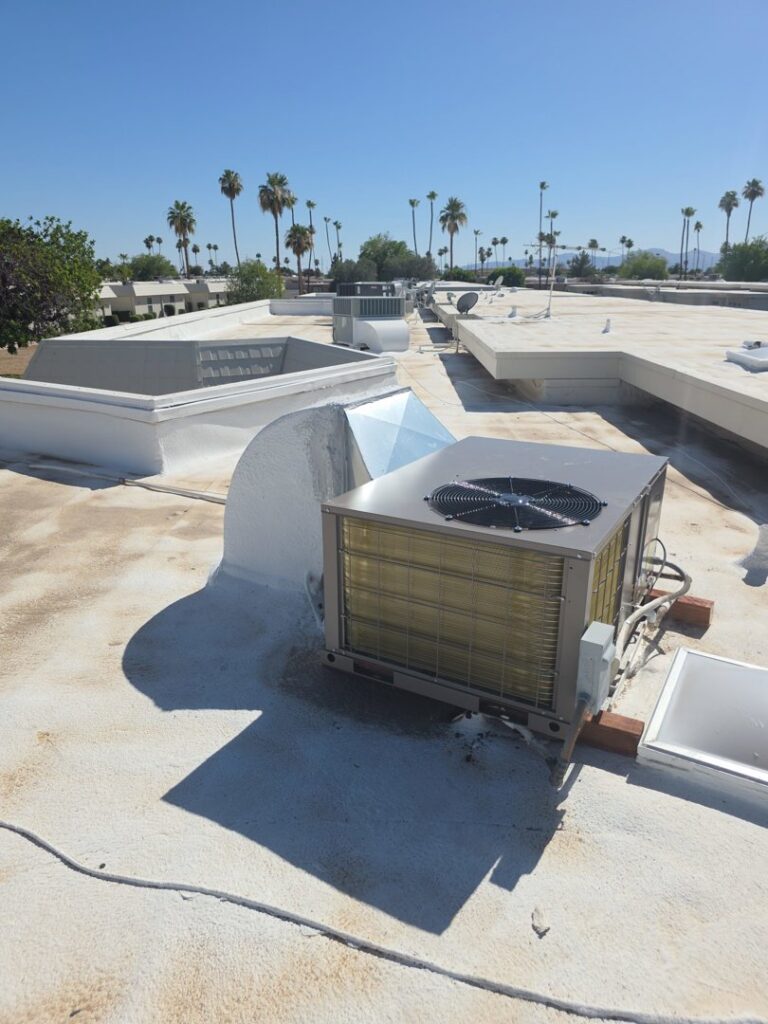 A commercial rooftop HVAC unit with ductwork installed on a flat roof by Krahn and Son Mechanical in Glendale, AZ.