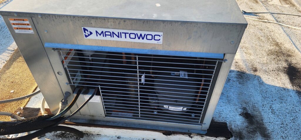 A commercial rooftop HVAC unit, potentially installed or maintained by Nelke Mechanical in Keizer, OR.