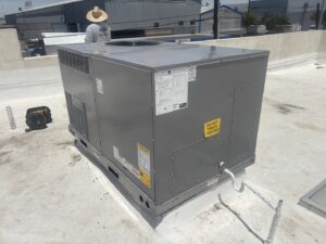 A large commercial rooftop HVAC unit being installed or serviced by Sun Devil Heating & Cooling INC in Peoria, AZ.