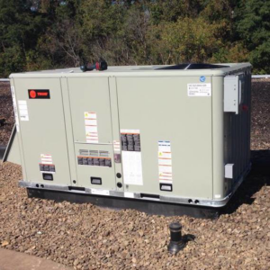 A large commercial rooftop HVAC unit by Trane, likely installed or serviced by J.M Heating, Air Conditioning and Refrigeration in Pittsburgh, PA.