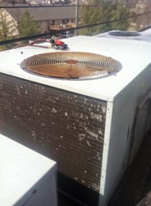 A large commercial rooftop HVAC unit, showing equipment maintained by Johnson's Heating and Cooling in Clarksville, TN.