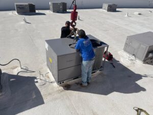 A newly installed commercial rooftop HVAC unit with electrical connections by Klee's Climate Control in Mesa, AZ.