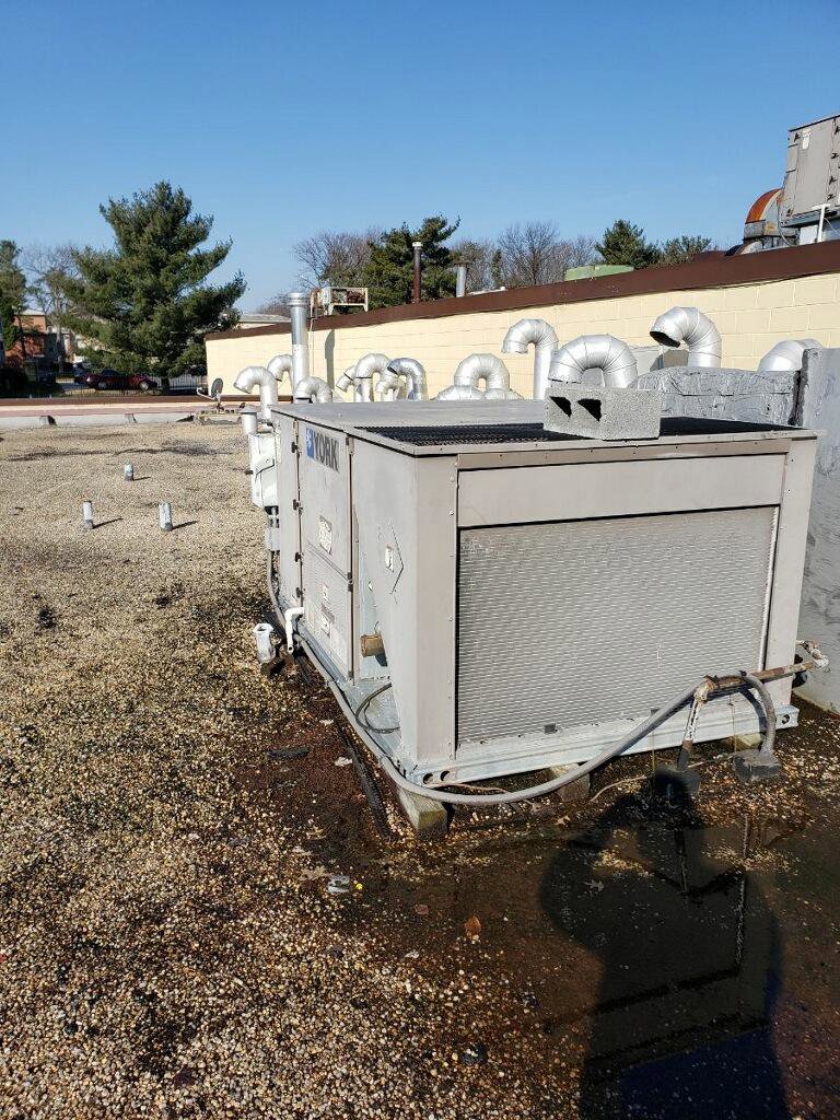 A large commercial rooftop HVAC unit by York, installed by JDL HVAC Services, LLC in Laurel, MD.