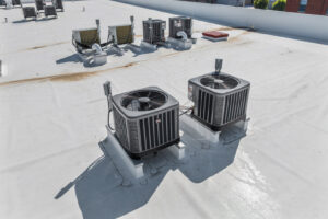 Two large commercial rooftop HVAC condenser units installed by Brad Emberton's HVAC in Owensboro, KY.