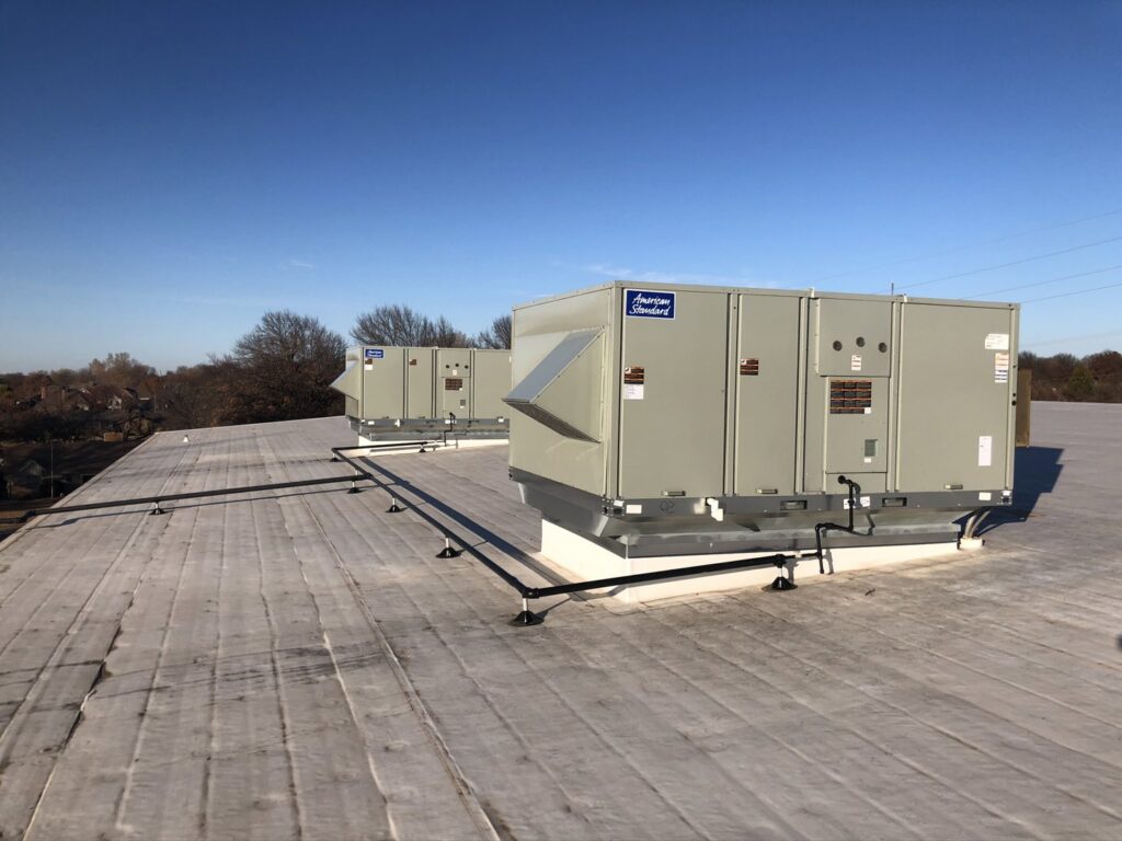 Two large commercial rooftop HVAC units by American Standard installed by Crouch's Heating & Cooling LLC in Stillwater, OK.