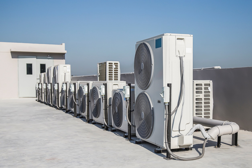 Multiple commercial HVAC units installed on a rooftop, serviced by Custom Heating & Air Conditioning - Nampa in Nampa, ID.