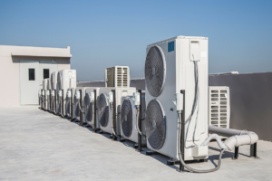 Multiple commercial HVAC units installed on a rooftop, serviced by Custom Heating & Air Conditioning - Nampa in Nampa, ID.