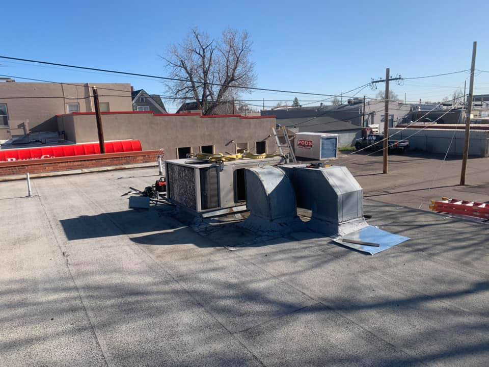Multiple commercial rooftop HVAC units and ductwork installed by 413 Services in Piedmont, SD