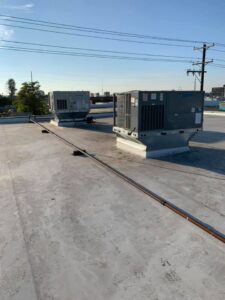 Two commercial rooftop HVAC units installed by Finney Heating and Cooling LLC in Post Falls, ID.