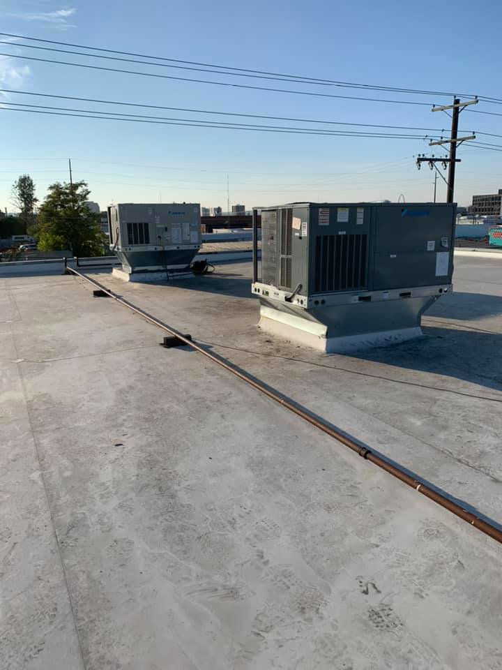 Two commercial rooftop HVAC units installed by Finney Heating and Cooling LLC in Post Falls, ID.
