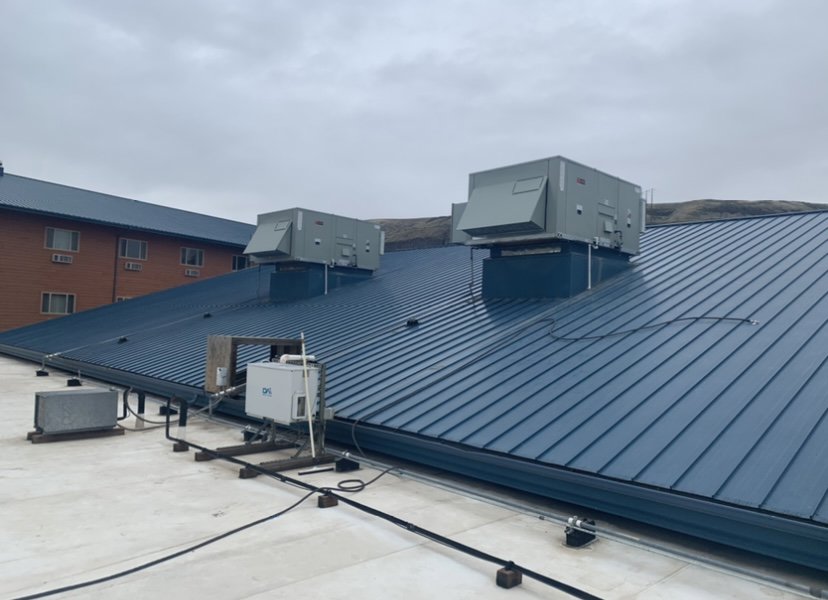 Multiple commercial rooftop HVAC units installed on a building by AP HVAC in Ridgewood, NY.