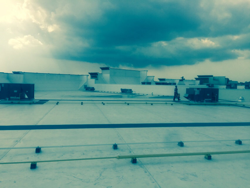 Commercial rooftop HVAC units on a building, showing installation or maintenance by Calloway & Sons A/C And Heating in New Orleans, LA.