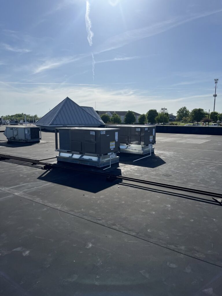 Commercial rooftop HVAC units installed by Wright Heating and Air in Louisville, KY.