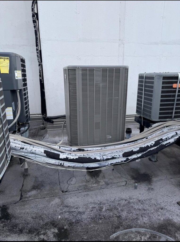 Multiple commercial rooftop HVAC units installed and maintained by ProTexAir HVAC Services in Houston, TX.