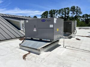 Commercial Carrier rooftop HVAC units on a building, serviced by Reliable Heating and Air LLC in Summerville, SC.