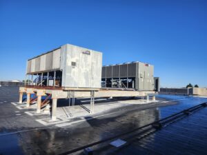 Two large commercial rooftop HVAC units, one older and one newer, installed by SBS-NC, LLC in High Point, NC