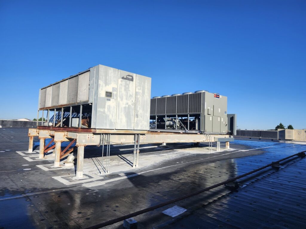 Two large commercial rooftop HVAC units, showcasing installation and maintenance by SBS-NC, LLC in High Point, NC.