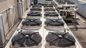 Multiple commercial rooftop HVAC units and ventilation systems installed by Tim Force Tin Shop in Casper, WY.