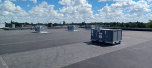 Multiple commercial rooftop HVAC units on a building serviced by Tornado Heating and Air in Tulsa, OK.
