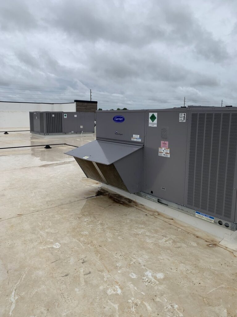 Multiple commercial rooftop HVAC units, showcasing installations by U.S. HVAC Services in Madison, AL.