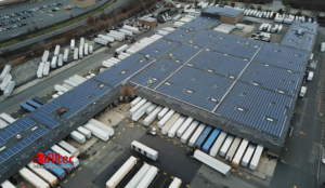 An aerial view of a commercial rooftop solar panel installation by Altec Building Systems in Point Pleasant, NJ.