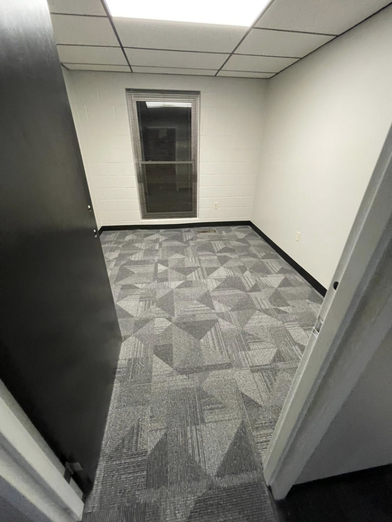 Finished patterned carpet tile installation in a commercial room by A Step Above Flooring in Lexington, KY