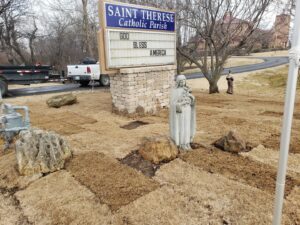 Commercial sod installation around a church sign and statue by GAMAS Lawn Care Services in Tulsa, OK.