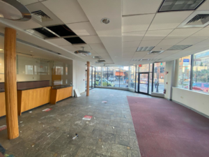 Exposed electrical wiring and ceiling fixtures in a commercial space during renovation by Hanlon Electric, LLC in Coventry, RI.