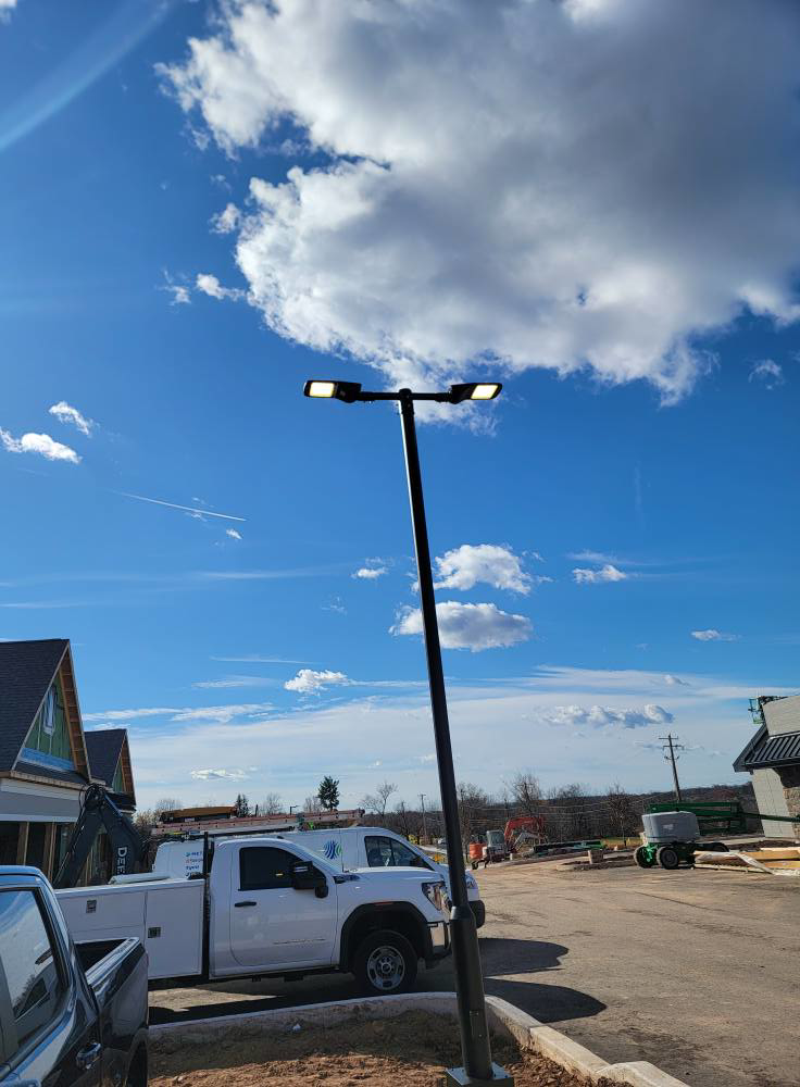 Commercial street lighting installation with a dual-head LED fixture by BESTA in Perkasie, PA.