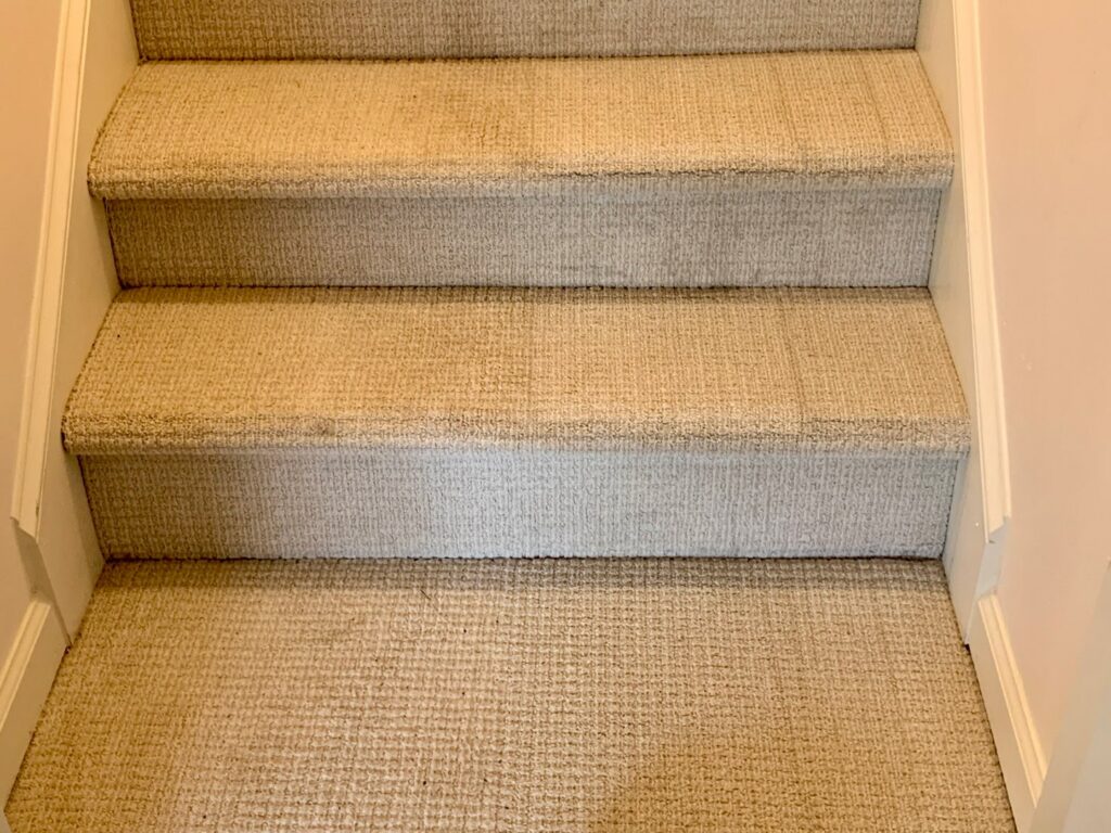 A commercial tile floor showing a clear before-and-after of professional tile cleaning by Atlanta Top Force Carpet Cleaning in Roswell, GA.