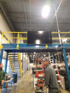 Commercial TV mounting and installation in an industrial setting by Julio A Lopez Electrician in Lowell, MA.