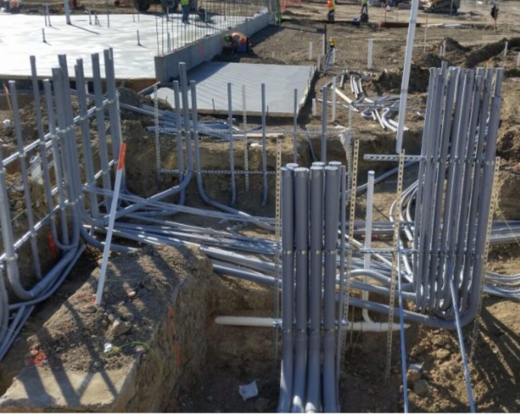 Commercial construction site showing extensive underground conduit and wiring installation by Access Electrical in Indianapolis, IN.
