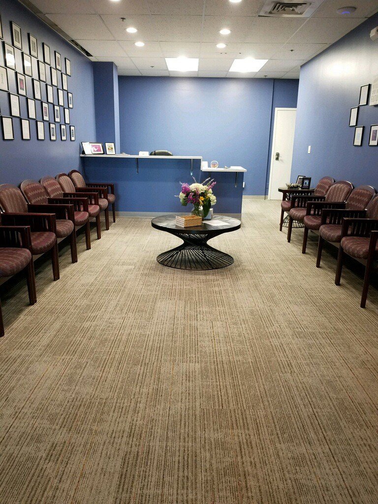 A commercial waiting room with new carpet installed by Harry's Carpet One in Quincy, MA.