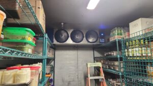 Interior of a commercial walk-in cooler showing multiple evaporator units, serviced by Kade Mechanical in Phoenix, AZ.