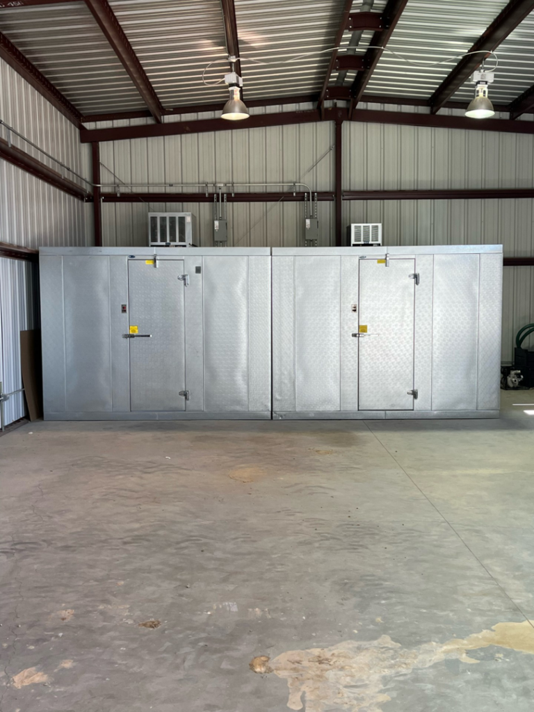 Two large commercial walk-in refrigeration units installed inside a building by Four Corners Service Co. in Farmington, NM.