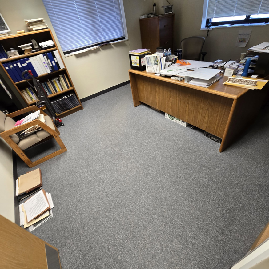 Freshly installed grey wall-to-wall carpet in a commercial office by LaValle Flooring Inc - Valley City in Valley City, ND.