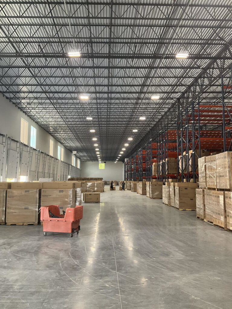 Bright overhead lighting in a commercial warehouse installed by North Springs Electric Company in Sandy Springs, GA.