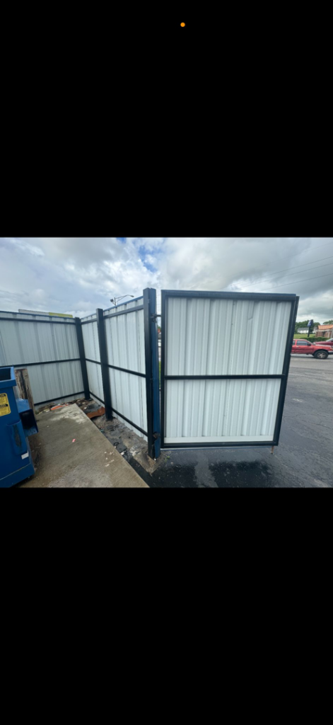 A commercial white corrugated metal privacy fence enclosure installed by JV Fences in Lexington, KY.