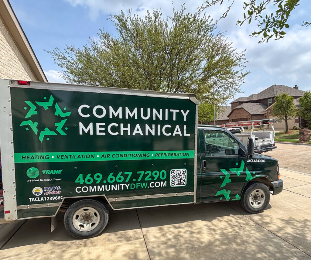 A Community Mechanical service truck parked at a residential job site in Plano, TX.