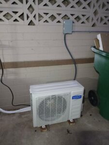 A compact outdoor mini-split condenser unit installed by BH cooling & Heating in Glendale, AZ.