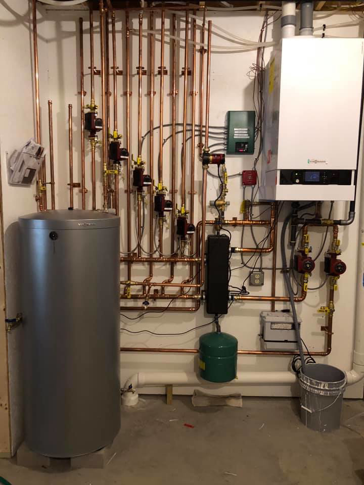 Boiler and hot water system with copper piping and controls installed by Ausoli Grace Plumbing & Hvac in South Portland, ME.